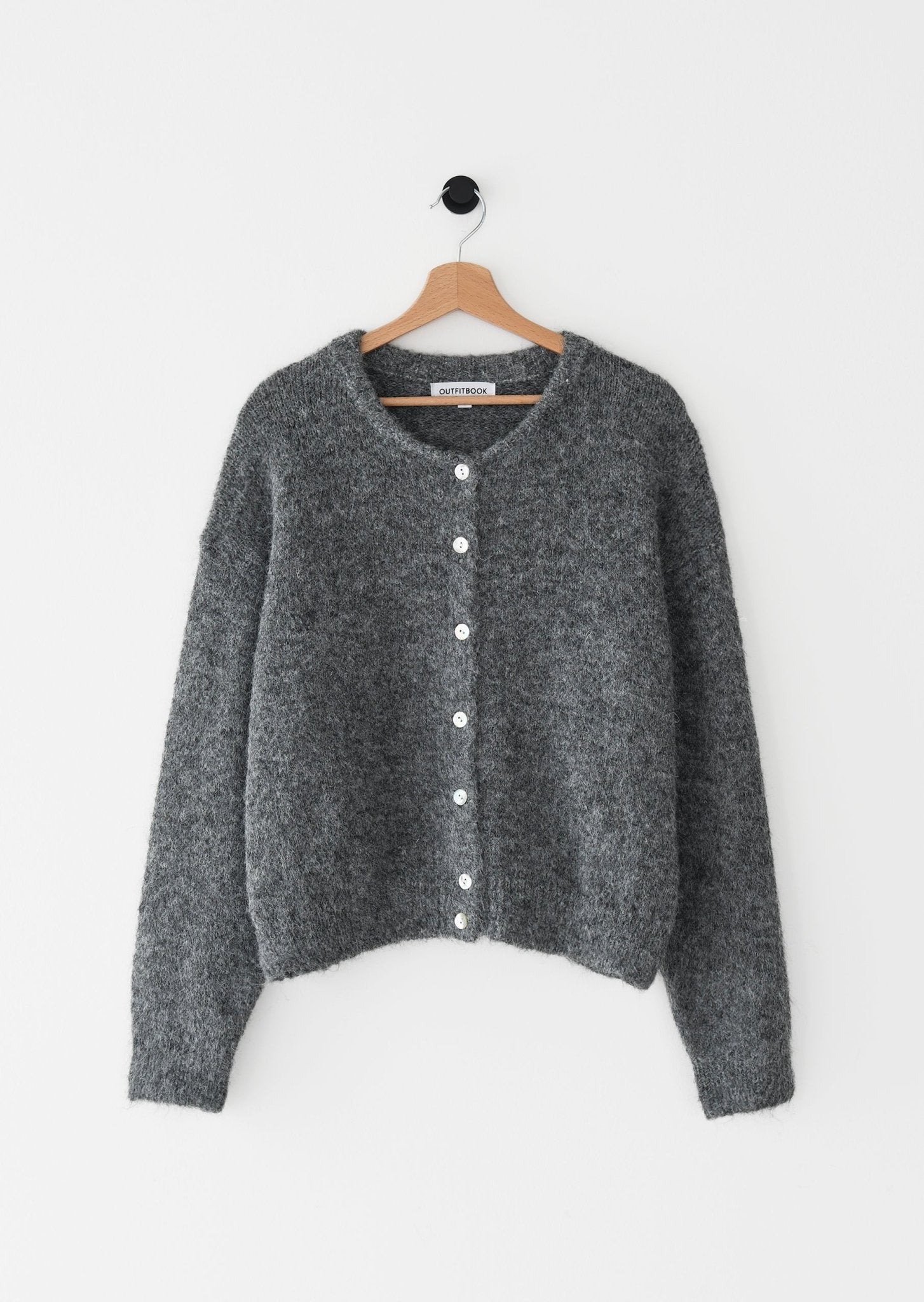 Buttoné– A stylish and elegant take on "buttoned. - Soliqlo